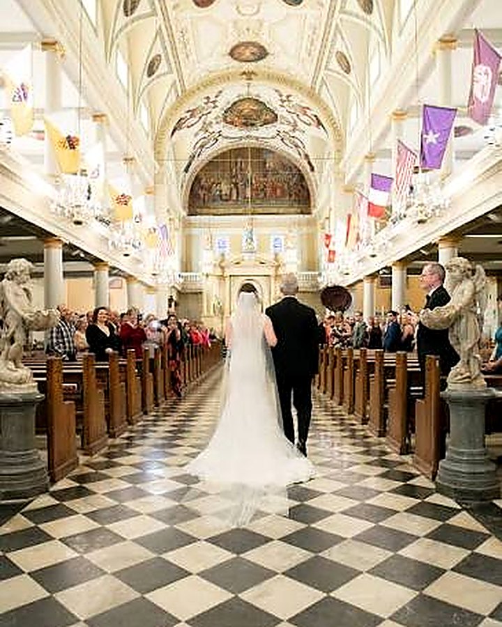 Bride walking down the aisle at St. Louis Cathedral in the French Quarter