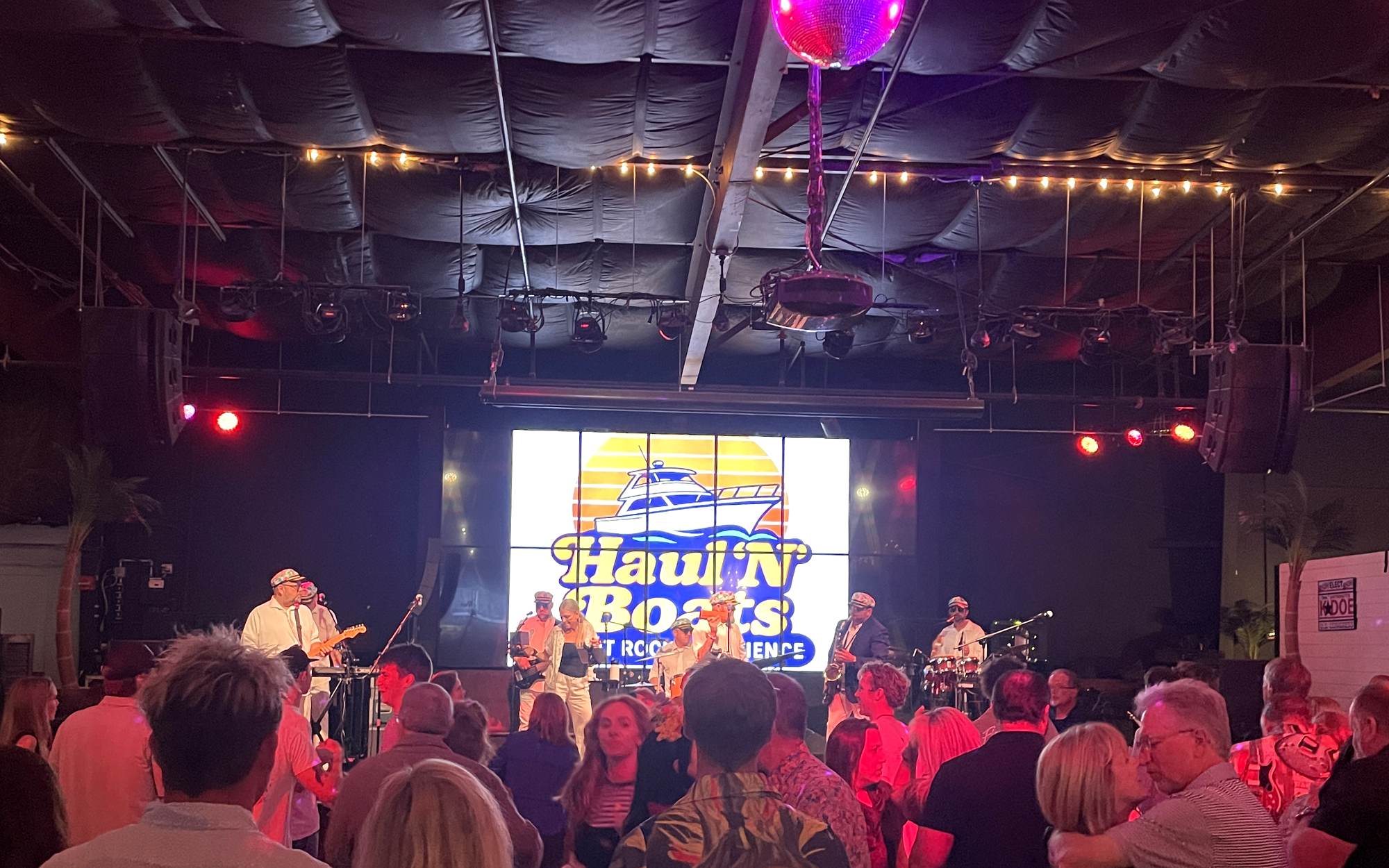 Packed dance floor at a Haul 'N Boats yacht rock show