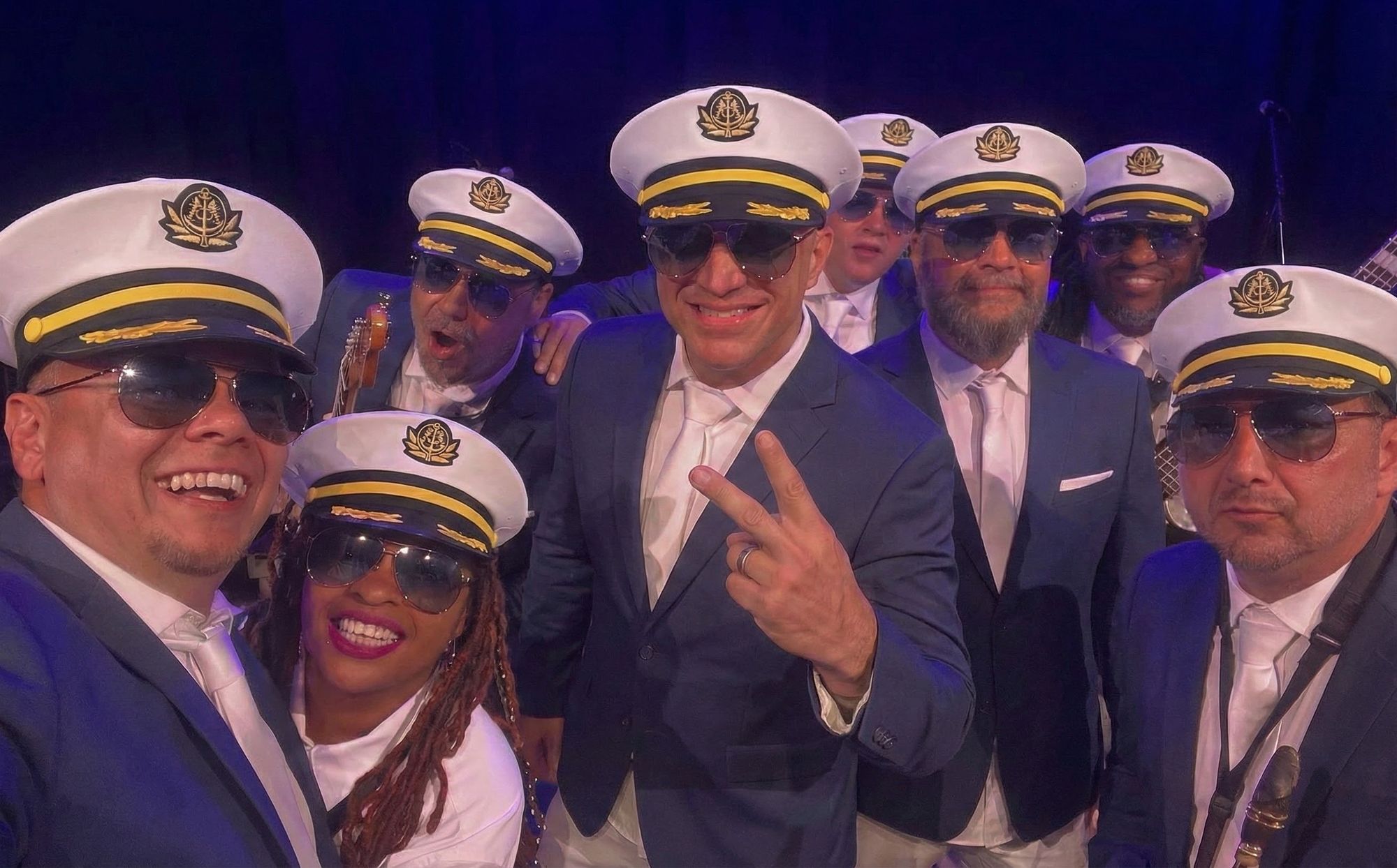 The Haul 'N Boats band in navy blazers, captain's hats and aviators