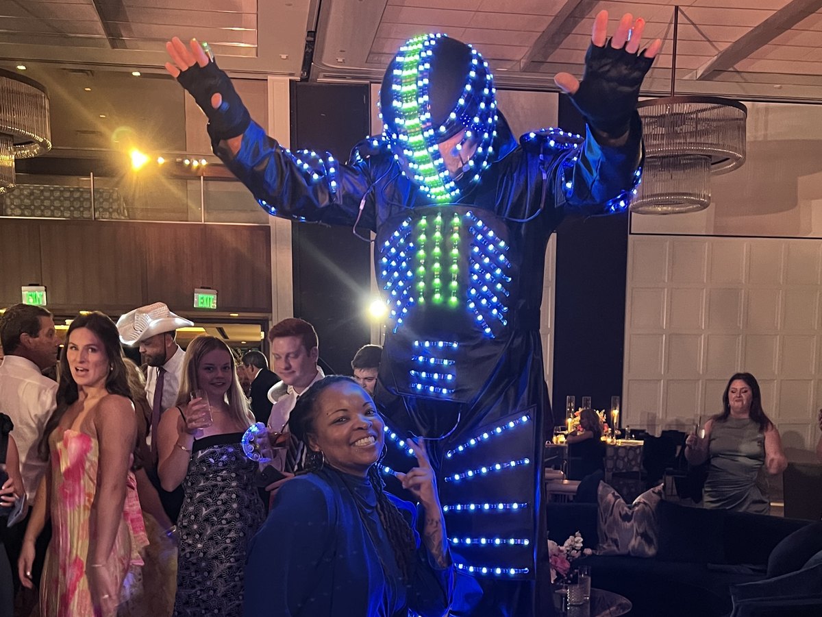 LED stilt performers working the room at a New Orleans ball